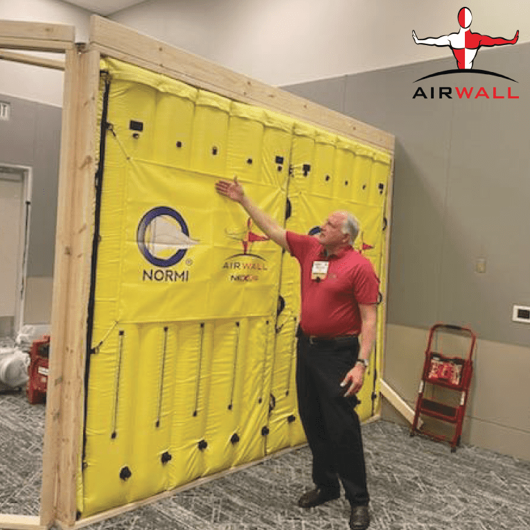 Man looking at AIRWALL Containment System